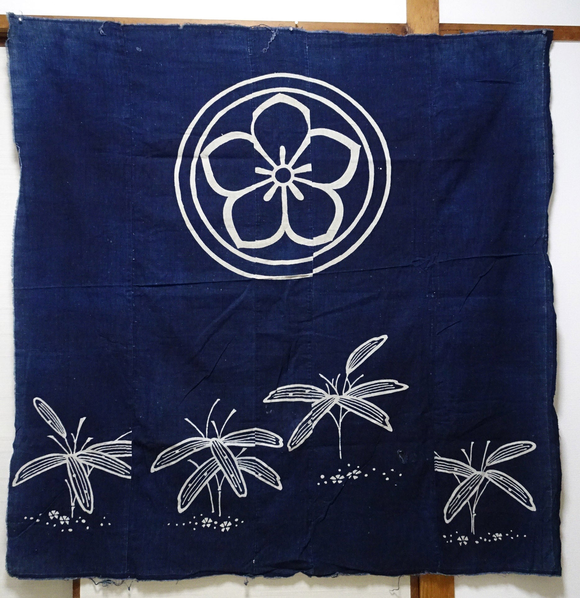 Japanese Antique Tsutsugaki Indigo-Dyed Boro Cloth with Floral Family Crest and Grass Motifs 14016