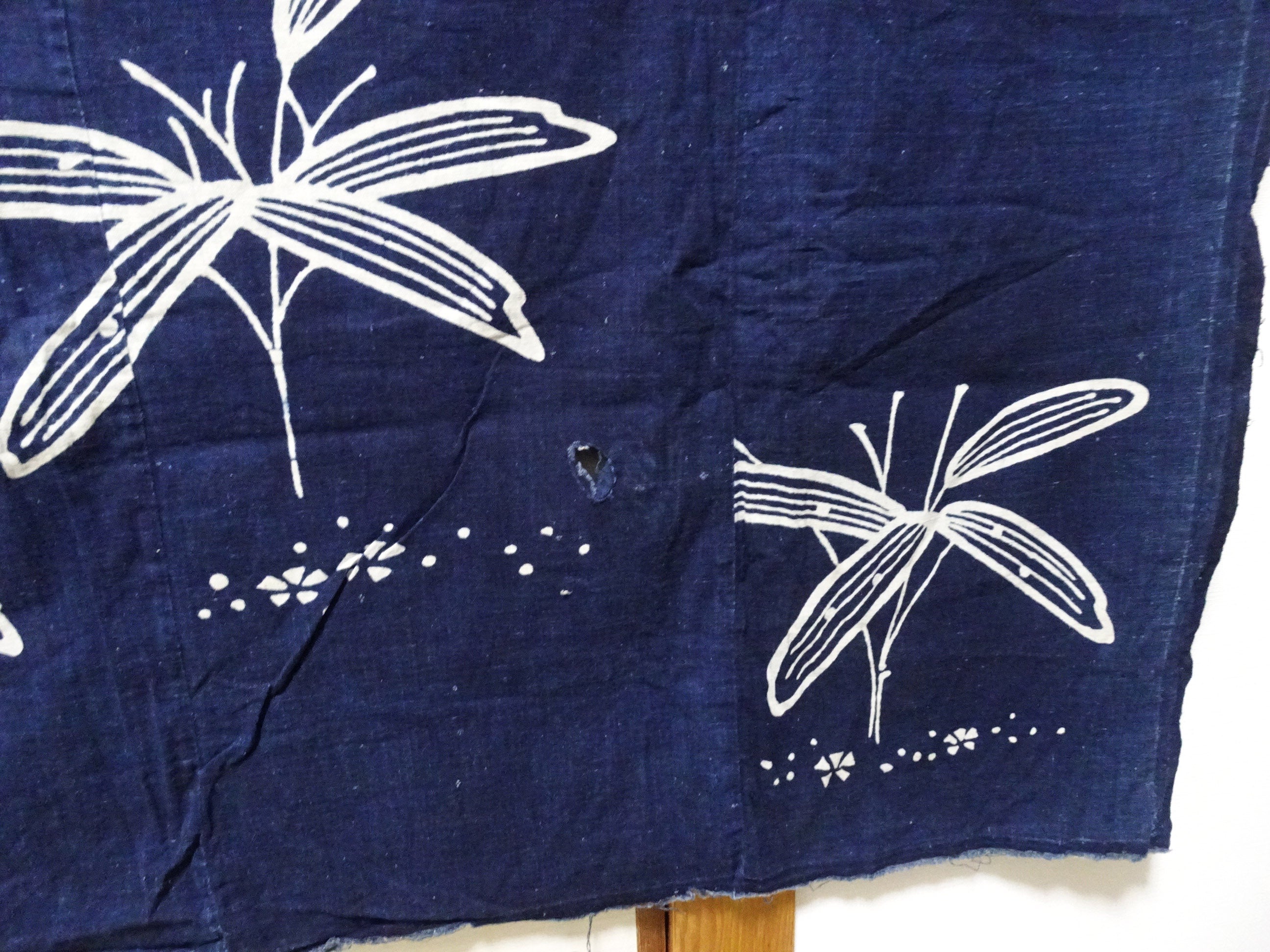 Japanese Antique Tsutsugaki Indigo-Dyed Boro Cloth with Floral Family Crest and Grass Motifs 14016