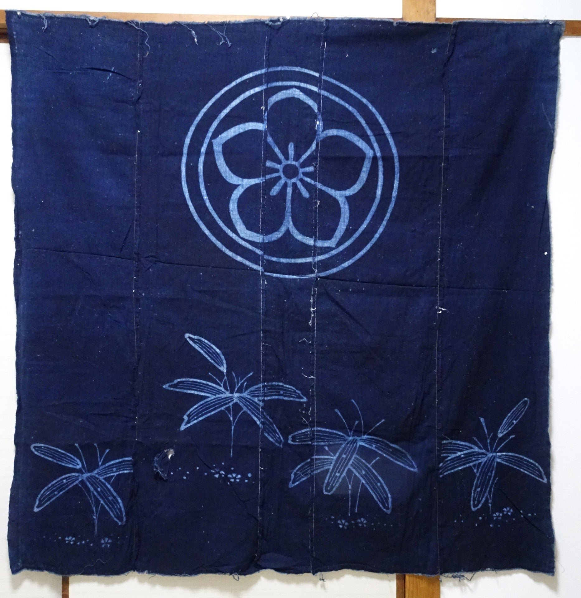 Japanese Antique Tsutsugaki Indigo-Dyed Boro Cloth with Floral Family Crest and Grass Motifs 14016