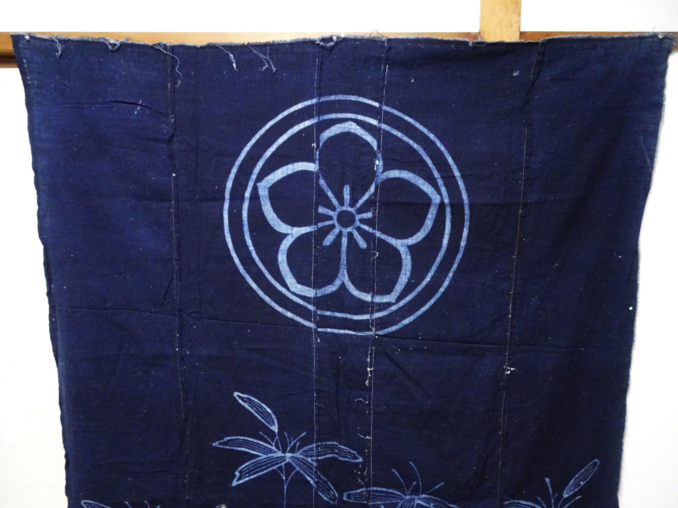Japanese Antique Tsutsugaki Indigo-Dyed Boro Cloth with Floral Family Crest and Grass Motifs 14016